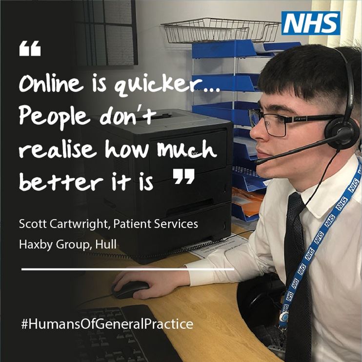 A male GP receptionist sits at an office desk 'online is quicker, people don;t realise how much better it is'