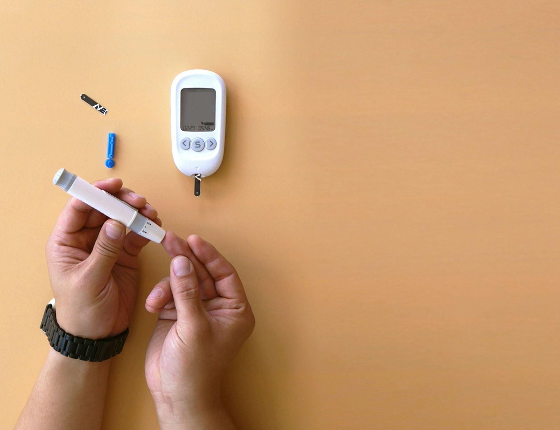 Blood glucose meter is inserted into finger