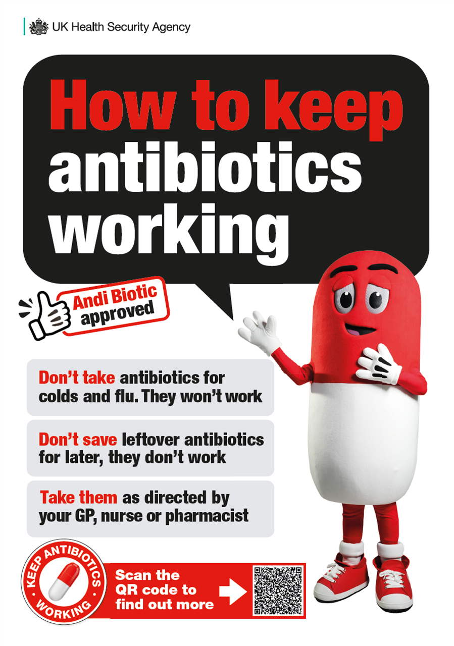 A red and white antibiotic tablet wearing trainers stands and points